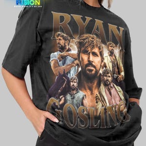May include: Black unisex t-shirt featuring a collage of images of Ryan Gosling with the name "RYAN GOSLING" in a vintage style. The shirt has the "FASHION FUSION" logo at the top left.