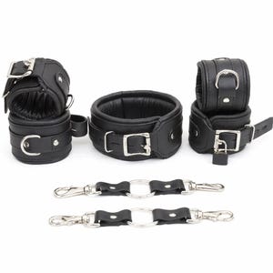 May include: A set of black leather restraints, including wrist cuffs, an ankle cuff, and a neck collar. The cuffs and collar have silver buckles and are padded. Two connecting pieces with metal rings and clasps are also included.