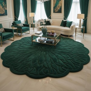 May include: An opulent living room featuring a large, dark green floral rug. The rug's design is the focal point, complemented by matching green curtains, armchairs, and a sofa. The room's decor creates a luxurious and coordinated aesthetic, with a central rug.