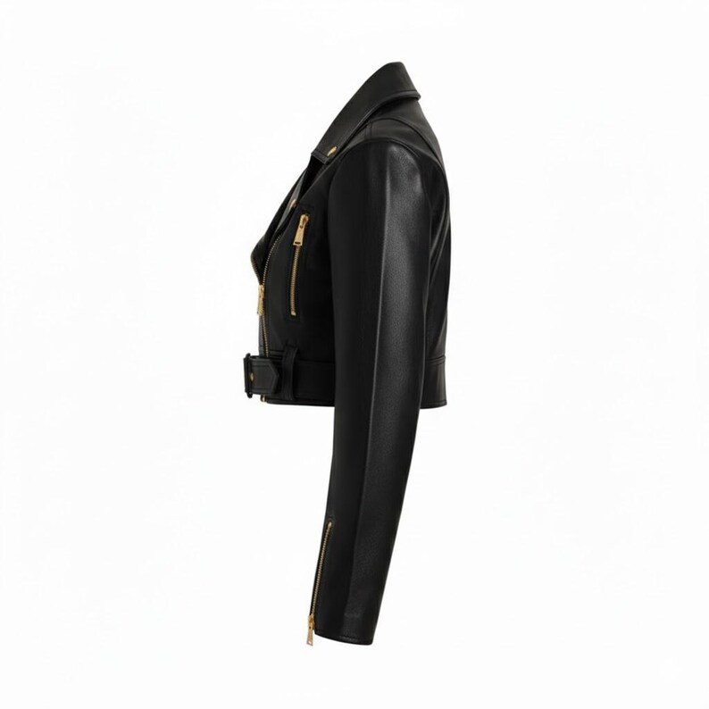 May include: Black leather jacket with a notched collar, asymmetrical zipper closure, and gold-tone hardware. Features a belted waist and zippered sleeves. A classic biker-style jacket.