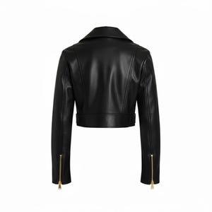 May include: Black leather jacket with a notched collar, long sleeves, and a cropped waist. The jacket features a belt detail at the waist and gold-toned zippers on the sleeves. The back view of the jacket is shown against a white background.