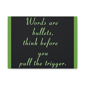 May include: A canvas art piece with a black background and green borders. The text "Words are bullets, think before you pull the trigger" is written in a cursive, light green font.