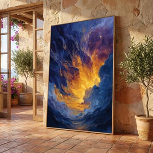 May include: A framed abstract painting with a vibrant display of colors. The artwork features a dynamic composition of swirling blues, oranges, and yellows, evoking a sense of a celestial event. The painting is displayed against a textured stone wall, with a terracotta tile floor.