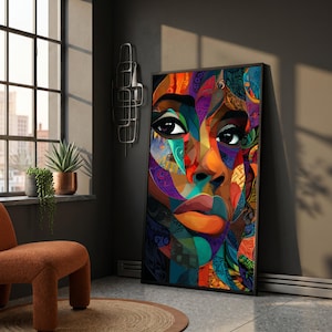 May include: A rectangular wall art print featuring a vibrant, abstract portrait of a face composed of geometric shapes and intricate patterns in shades of orange, blue, purple, and yellow, framed in a thin black border and displayed vertically.