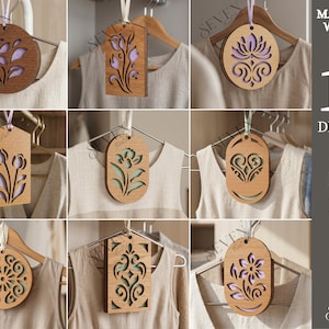 May include: Ten wooden designs with floral and ornamental cutout patterns are shown hanging on hangers. The designs are made of 3mm thick material. The image showcases the variety of shapes and styles available.