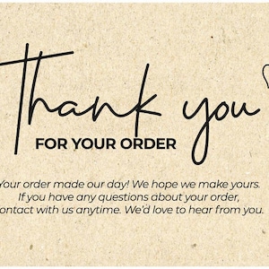 May include: A beige card with black handwritten text that says "Thank you FOR YOUR ORDER". A small heart is drawn next to the word "you". Additional text below the main message.