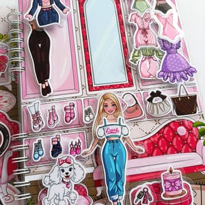 May include: A colorful sticker book featuring a fashion theme. The book includes a doll, clothing, shoes, handbags, and a poodle. The background is pink with a mirror and a red sofa. The doll is wearing a white top and blue jeans.
