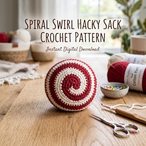 May include: A red and white spiral-patterned hacky sack crochet ball. The image also shows yarn, a crochet hook, scissors, and the text "SPIRAL SWIRL HACKY SACK CROCHET PATTERN Instant Digital Download".