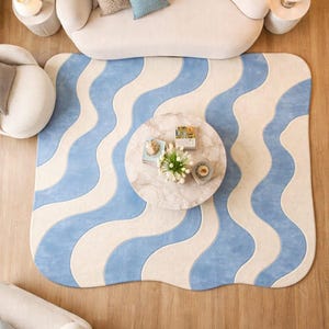 Könnte beinhalten: Ein Satz von drei Keramik-Nisttöpfen in Blau-, Grün- und Weißtönen. Die Schalen haben eine gesprenkelte Glasur und ein schlichtes Design. Die größte Schüssel hat einen Durchmesser von ca. 15 cm.