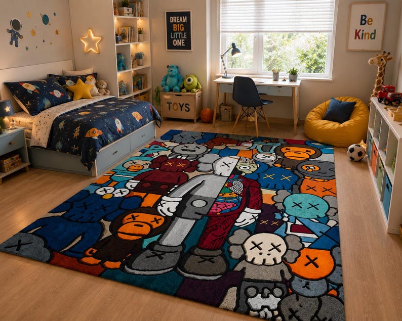 May include: A colorful area rug featuring a repeating pattern of cartoon figures in various colors. The rug has a mix of blues, oranges, grays, and reds, with a large central figure. The rug is placed in a child's bedroom.