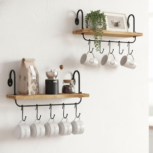 May include: A rustic wooden sign with the text "Welcome to our home" in white lettering. The sign features a distressed finish and a simple, inviting design, perfect for entryway decor.