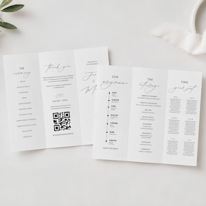 May include: White wedding programs with elegant calligraphy. One program lists the ceremony details, while the other features the reception schedule and seating chart. A QR code is included for sharing photos.