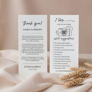 May include: Two white wedding cards with black text. One card says "Thank you! Family & Friends" and includes a message. The other card says "I Spy" with photo suggestions. Wheat stalks are in the foreground.