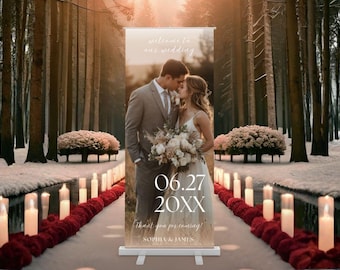 May include: A wedding welcome sign featuring a couple kissing, with the date "06.27 20XX" and the names "Sophia & James". The sign is set in a snowy forest with candles and floral arrangements.