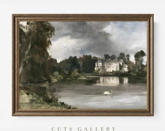 May include: A framed landscape painting depicting a stone castle situated on the edge of a calm lake under a cloudy sky. A single white swan swims in the water. The artwork is enclosed in a dark brown wooden frame with the text CUTS GALLERY.