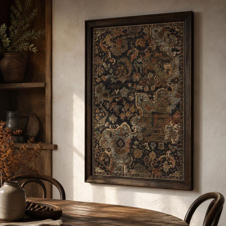 May include: A rectangular wall art piece featuring a dark, intricate floral and paisley pattern in shades of black, rust orange, muted blue, and cream, enclosed within a simple, dark brown wooden frame with a thin, textured border.