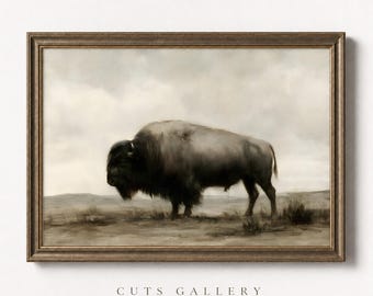 May include: A framed wall art print featuring a painting of a bison standing in a vast, muted landscape under a cloudy sky. The artwork is enclosed in a dark, textured wooden frame. The text CUTS GALLERY is printed below the framed image.