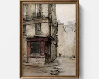May include: A framed watercolor painting depicting a street corner with a multi-story building featuring a dark red storefront. The scene includes muted beige and gray tones, architectural details like balconies, and two small figures walking in the distance.