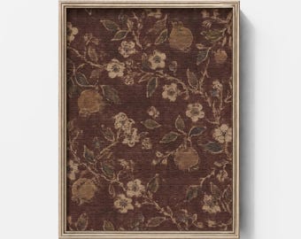 May include: A rectangular framed wall art piece featuring a dark brown background with a repeating pattern of light tan flowers, leaves, and round fruit. The frame is a metallic gold color with a thin, simple profile surrounding the print.