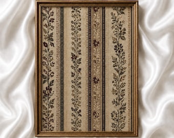 May include: A rectangular framed wall art piece featuring a vertical striped pattern with floral vines in shades of brown, beige, and dark red. The frame is a metallic gold color. The text CUTS GALLERY is printed in small black letters at the bottom.