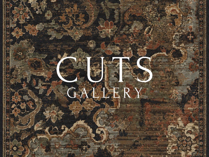 May include: A rectangular rug featuring a dark black background with an intricate floral pattern in shades of rust orange, muted green, and beige. The text CUTS GALLERY is printed in white in the center of the rug over the floral design.