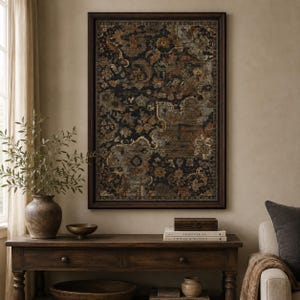 May include: A rectangular wall art piece featuring a dark, intricate floral and paisley pattern in shades of black, rust orange, and muted blue, enclosed in a dark brown wooden frame. The artwork displays a dense, ornate design with repeating motifs.