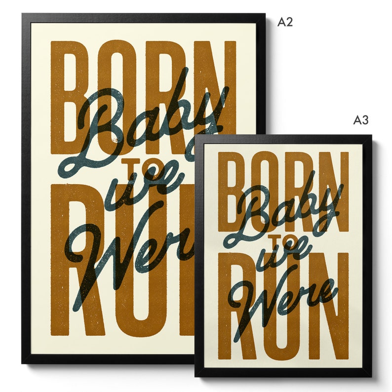 May include: Two framed prints with the text "Born to Run" in a stylized font. The text is in a dark blue color on a light brown background. The larger print is labeled "A2" and the smaller print is labeled "A3".