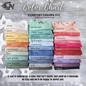 May include: A color chart displaying a variety of Comfort Colors 1717 unisex heavyweight tees. The chart showcases a range of colors, including white, ivory, mustard, and peachy. The text "Color Chart" is at the top.