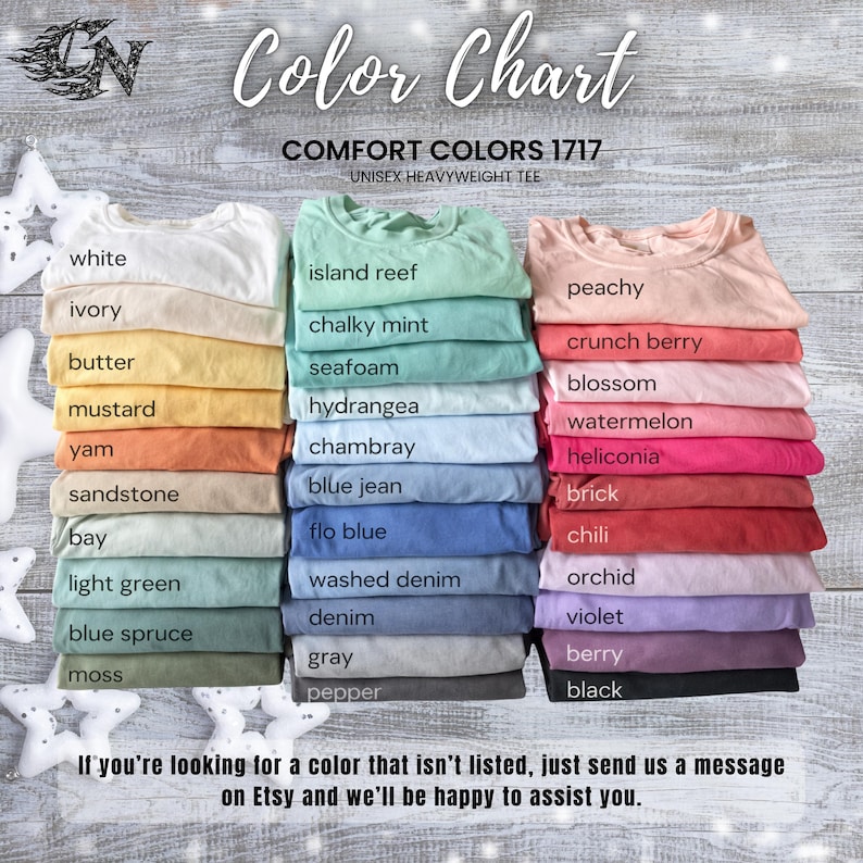 May include: A color chart displaying a variety of Comfort Colors 1717 unisex heavyweight tees. The chart showcases a range of colors, including white, ivory, mustard, and peachy. The text "Color Chart" is at the top.