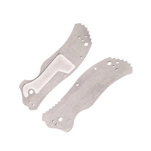 May include: Two silver-colored knife handle scales. One scale has a white insert and a curved shape with a serrated edge. The other scale is similar in shape and also has a serrated edge. Both have several small holes.