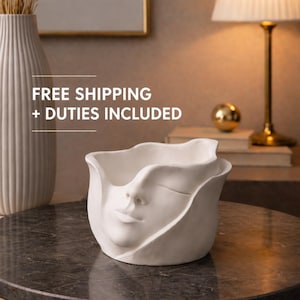 Stenpudervas med ansikte, minimalistisk skulptur, modern heminredning