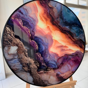 Round glass wall art on an easel, vivid purple and gold marble swirls, geode style, modern glass wall decor
