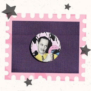May include: A round button featuring a man with a surprised expression holding a pink flamingo. The background of the button is a pink and black pattern. The button is set against a purple background with a pink border and star accents.