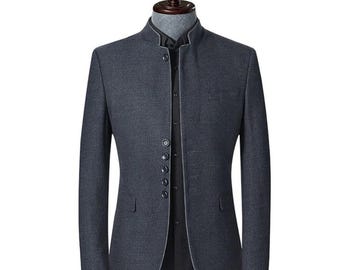 May include: A dark gray blazer with a mandarin collar and a button-up front. The jacket has a tailored fit and features two front pockets. The blazer is displayed on a mannequin.