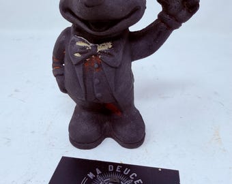 Voorste helft van vintage gietijzeren Mickey Mouse-bank, linkerhand omhoog