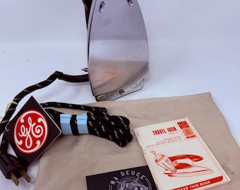 Ferro de viagem General Electric GE F47 da década de 1950, com função de spray, vapor e secagem.