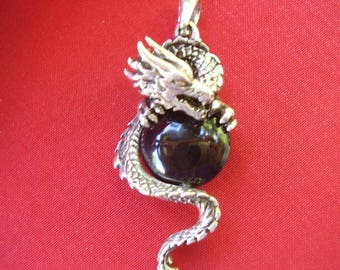 Vintage Pendant of Dragon Holding Black Onyx Cabochon