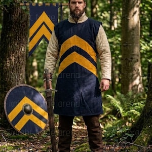 May include: A medieval-style outfit featuring a navy tunic with yellow chevron stripes, worn over a padded cream-colored undergarment. The ensemble includes brown pants, boots, and a sword. A matching shield and banner are also visible.