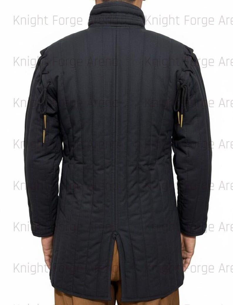 May include: Black quilted jacket with a high collar and vertical stitching. The jacket features decorative gold-colored accents on the sleeves and a split at the back hem. The text "Knight Forge" is visible in the background.