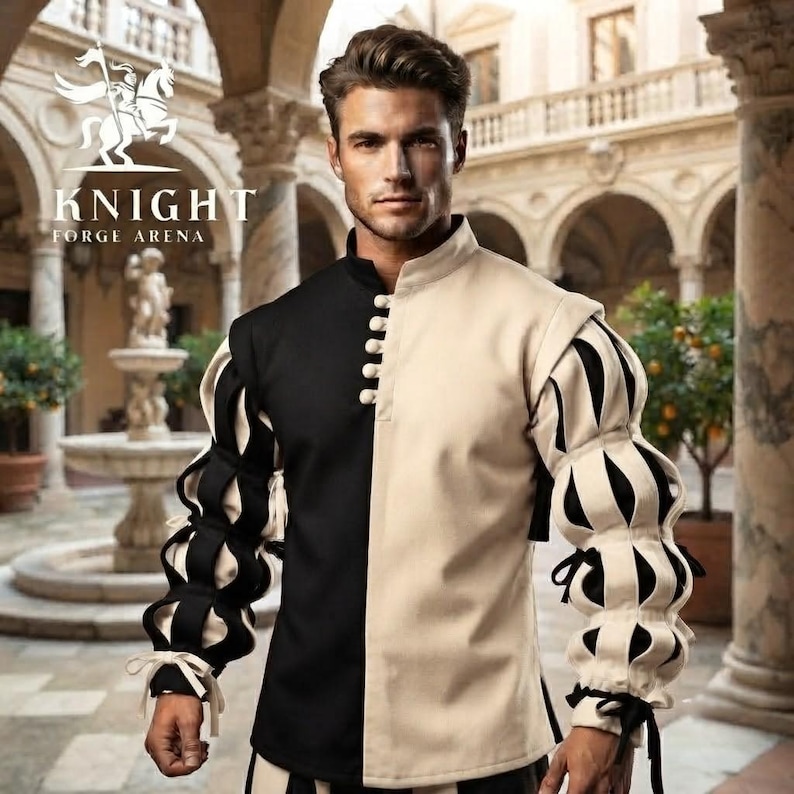Peut inclure: Un pourpoint &agrave; manches longues pr&eacute;sentant un design bicolore noir et beige, un col montant et une rang&eacute;e verticale de boutons. Les manches sont dot&eacute;es d'un motif bouffant et lac&eacute;r&eacute; r&eacute;v&eacute;lant un tissu noir en dessous, avec des liens aux poignets.