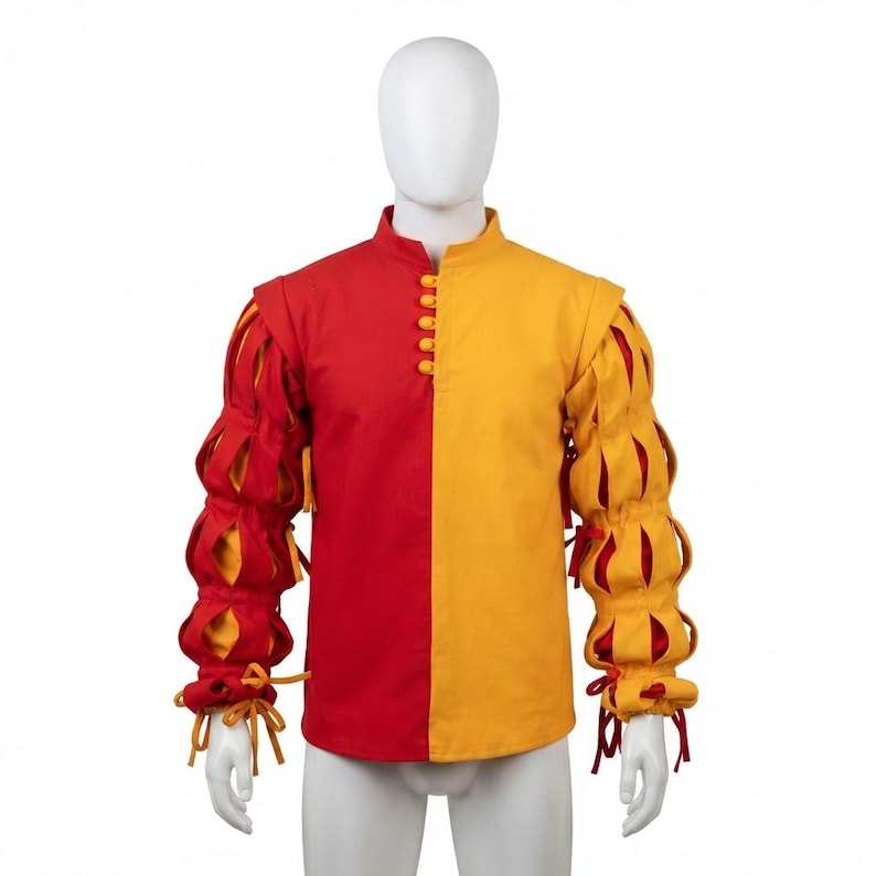Peut inclure: Une chemise &agrave; manches longues pr&eacute;sentant un design bicolore avec un c&ocirc;t&eacute; droit rouge et un c&ocirc;t&eacute; gauche jaune. Les manches sont compos&eacute;es de sections bouffantes et fendues r&eacute;v&eacute;lant un tissu contrastant, avec une rang&eacute;e de boutons.