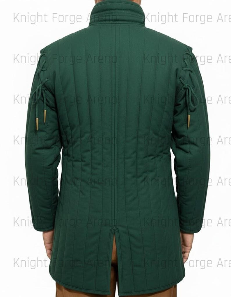 May include: A dark green quilted jacket with a high collar and long sleeves. The jacket has vertical stitching and decorative ties on the shoulders and sleeves. The back of the jacket is visible, with a split at the bottom. The text "Knight Forge Arena" is visible.