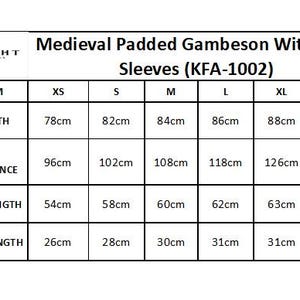 May include: A size chart for a Medieval Padded Gambeson with half-sleeves, model KFA-1002. The chart displays measurements in centimeters for sizes XS to XXL, including full length, width circumference, full arm length, and half arm length.
