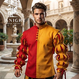 Peut inclure: Une chemise &agrave; manches longues pr&eacute;sentant un design divis&eacute; avec un c&ocirc;t&eacute; rouge et l'autre jaune. Le v&ecirc;tement poss&egrave;de un col montant, une rang&eacute;e verticale de boutons ronds et des manches avec des sections bouffantes s&eacute;par&eacute;es par des rubans.