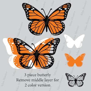 Puede incluir: Dise&ntilde;o de mariposa de tres piezas en capas en naranja, negro y blanco. El texto "3 piece butterfly" y "Remove middle layer for 2 color version" est&aacute; incluido en la imagen.
