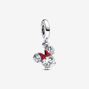 May include: A silver charm featuring a mouse-shaped silhouette with three clear round stones and a bright red enamel bow. The charm includes a circular bail engraved with the text PANDORA and S925, designed to hang from a bracelet or necklace chain.