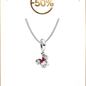 May include: A silver necklace featuring a pendant shaped like a mouse head with two clear round stones for ears and a larger clear round stone for the face, accented by a small red bow. Above the pendant, the text -50% is displayed in gold.