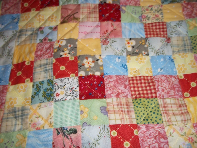 doll size quilt in 1 inch patchwork.