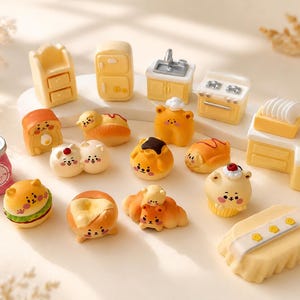 May include: A collection of miniature kitchen furniture and food-shaped figurines featuring cartoon faces. The set includes a pink scale, yellow cabinets, a stove, a sink, and various bread-themed characters like a burger, cupcake, and croissant.