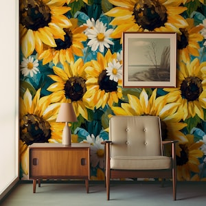 May include: A room with a sunflower and daisy floral wallpaper. A framed landscape painting hangs on the wall. A wooden side table with a lamp and a mid-century modern armchair complete the decor.